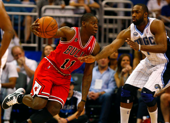 Chicago Bulls shooting guard Ronnie Brewer (11) drives to the basket as Orlando Magic point guard Gilbert Arenas (1) defends during the second half at the Amway Center.